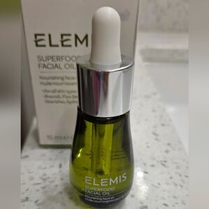 ELEMIS Superfood Facial Oil in green bottle with silver cap